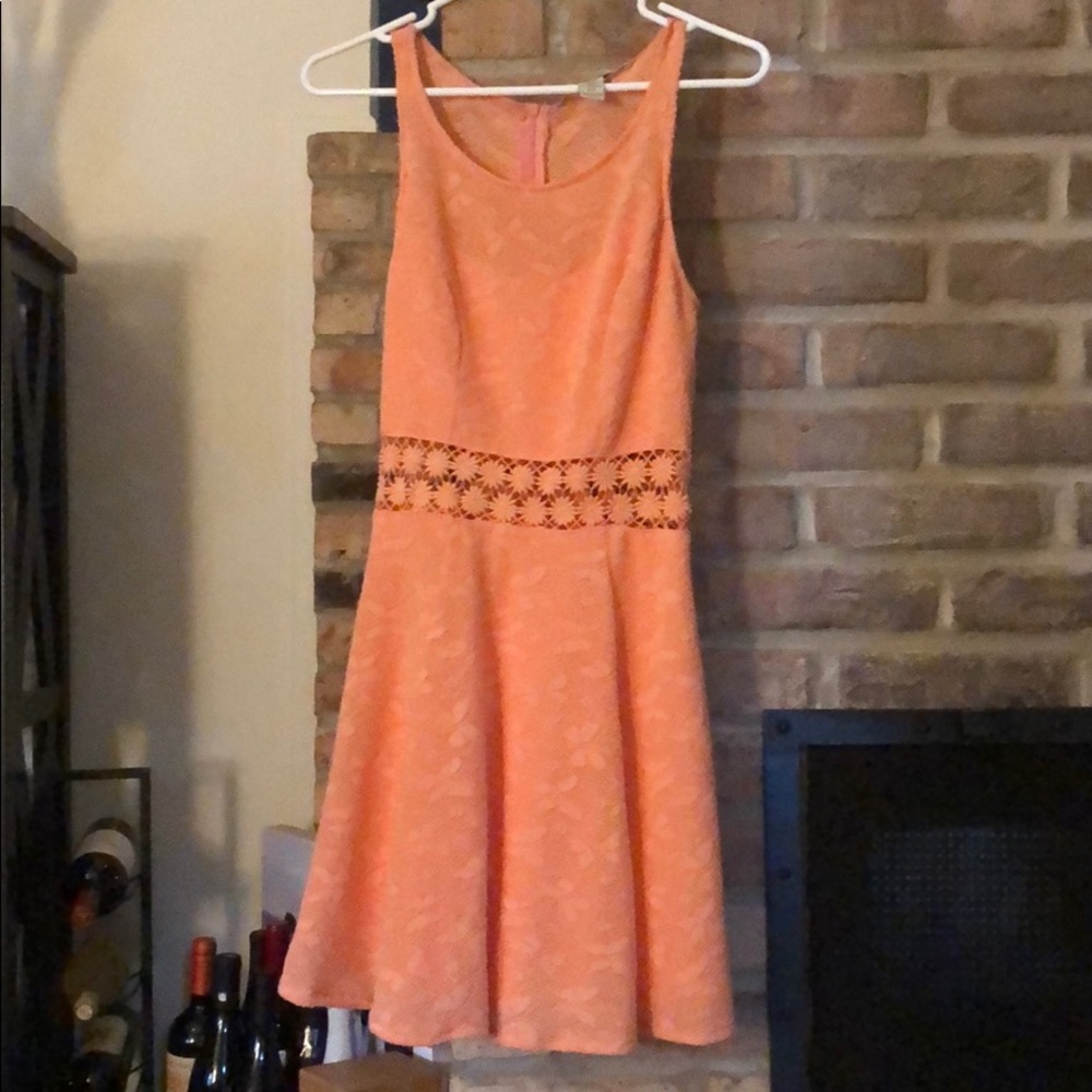 A line dress with flower cut out detail at waist